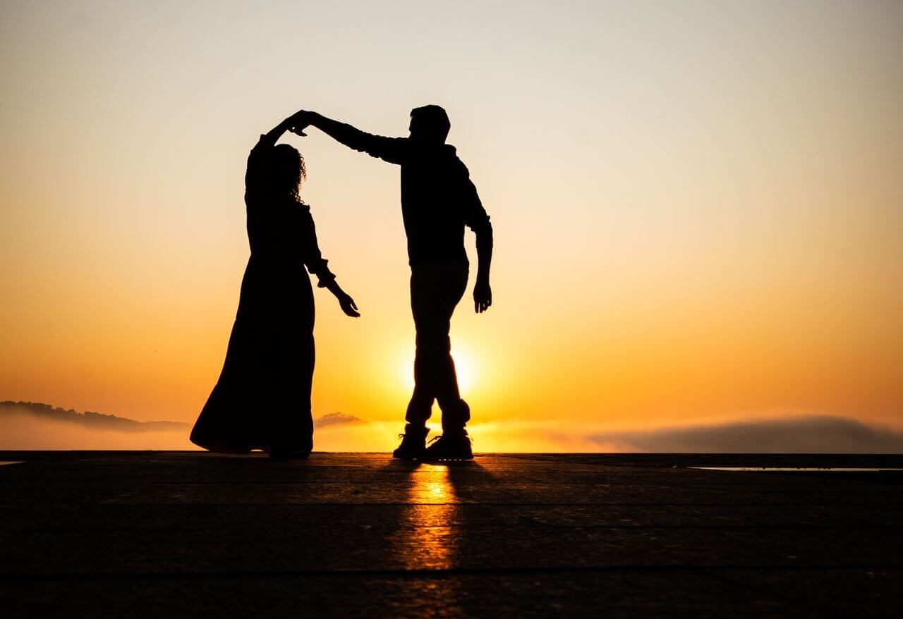 Couple dancing at a sunset in Sagres